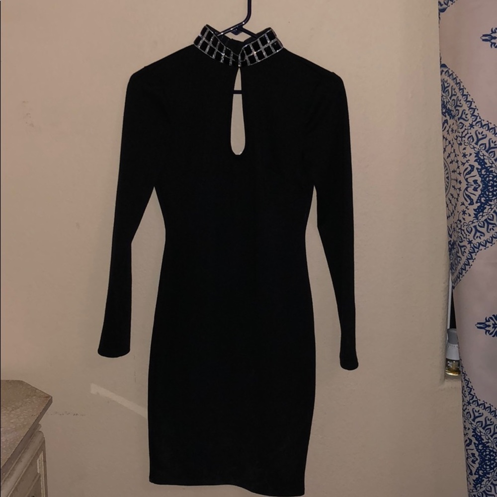 tight black with decorative chain collar dress